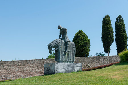 assisi,italy july 11 2020 :monument of a man on horseback placed in the garden in front of the basilica of san francesco di assisiのeditorial素材