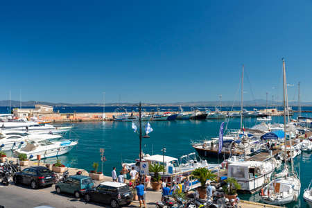 Porto Santo Stefano harbor with boats and the seaの写真素材