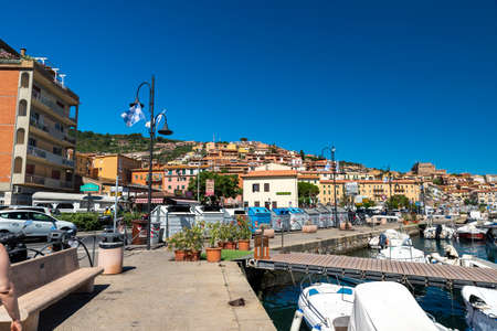 Porto Santo Stefano harbor with boats and the seaの写真素材