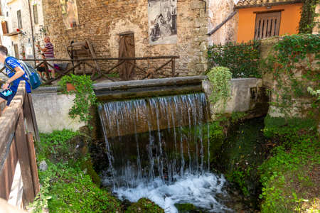 Streams that form small waterfalls in the center of the town of rasigliaの写真素材