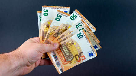 man with 50 euro banknotes