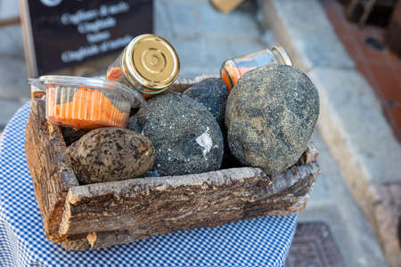basket of truffles displayed outside a shopの写真素材