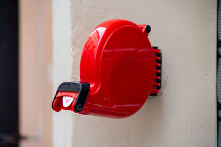 red color shop queue eliminator fixed to the wallの写真素材