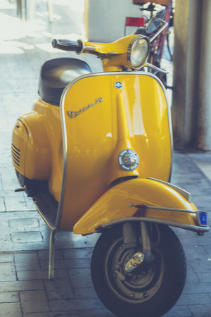 terni, italy september 05 2020: vintage piaggio vespa in yellow colorのeditorial素材
