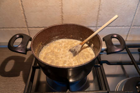 risotto with truffles and parmesan boiling in a potの写真素材
