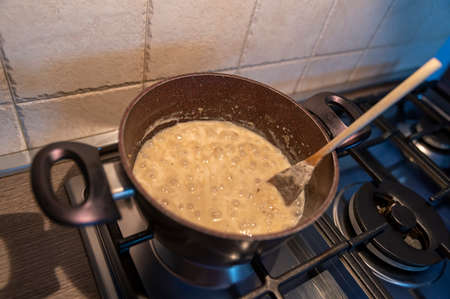 risotto with truffles and parmesan boiling in a potの写真素材