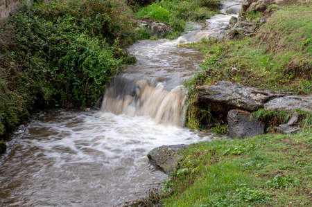 the waterfall of nepi surrounded by greenery in provoncia di romeの写真素材