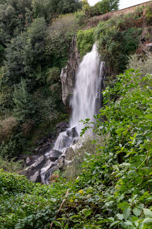 the waterfall of nepi surrounded by greenery in provoncia di romeの写真素材