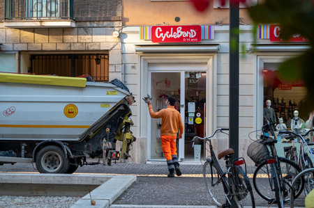 terni, italy actober 10 2020: a man in the park with his dog doing needs with a medical maskのeditorial素材