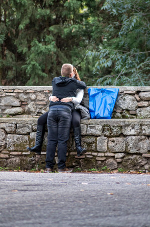 terni, italy october 13 2020: black man sitting on a bench at the parkのeditorial素材