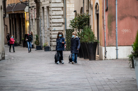 terni, italy actober 17 2020: black gardener who works for the municipality of terniのeditorial素材
