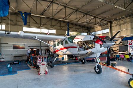 detail of a parachuting plane stopped in a hangarのeditorial素材