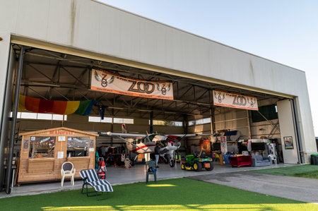 hangar of the skydiving school with his plane stationary insideのeditorial素材