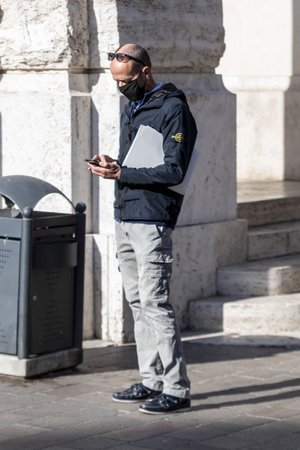 businessman looking at phoneのeditorial素材