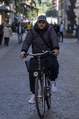 man on bicycle in city centerのeditorial素材
