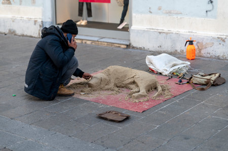 street artist making composition of a dog with sandのeditorial素材