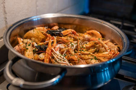 fresh fish soup with scampi and seafoodの写真素材