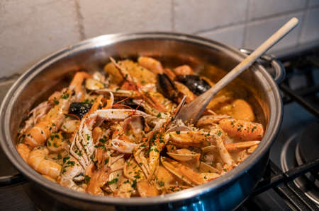 fresh fish soup with scampi and seafoodの写真素材