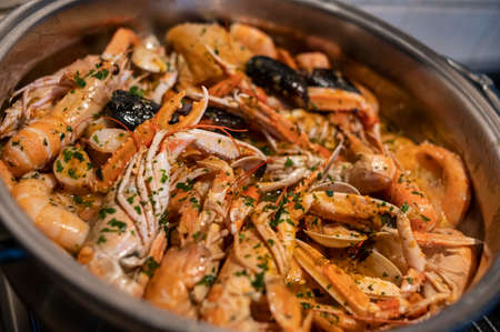 fresh fish soup with scampi and seafoodの写真素材