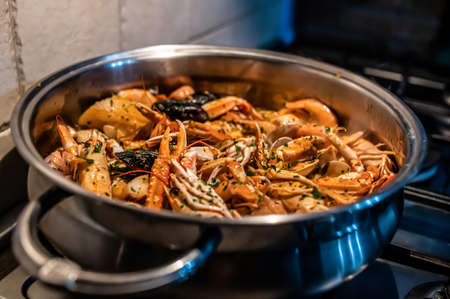 Prawns to drain ready for fresh fish soup with seafoodの写真素材