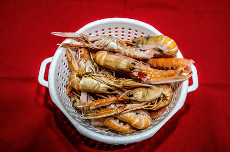 Prawns to drain ready for fresh fish soup with seafoodの写真素材
