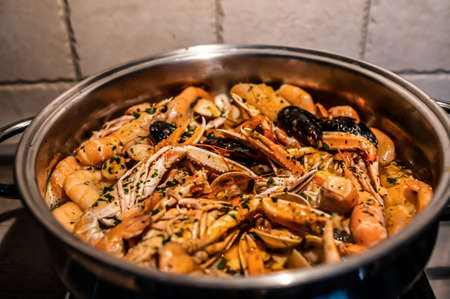 Prawns to drain ready for fresh fish soup with seafoodの写真素材