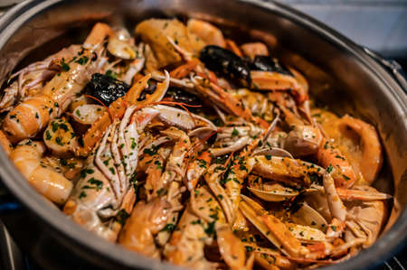 Prawns to drain ready for fresh fish soup with seafoodの写真素材