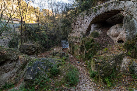 black river and its glimpses after the marble waterfall in winterの写真素材