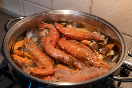 tomato fish soup with seafood, clams, Argentine prawnsの写真素材