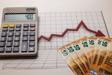50 euro banknotes coins and statistics on white backgroundの写真素材