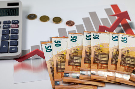 50 euro banknotes coins and statistics on white backgroundの写真素材