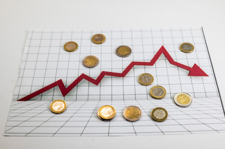 50 euro banknotes with statistics and calculator on white backgroundの写真素材