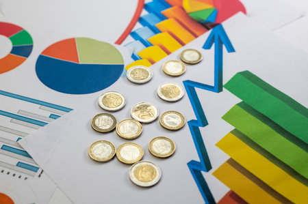 50 euro banknotes with statistics and calculator on white backgroundの写真素材