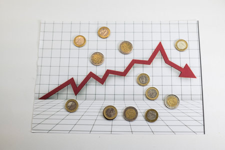 50 euro banknotes with statistics and calculator on white backgroundの写真素材