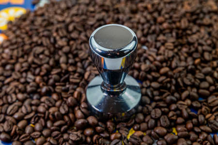 composition of coffee beans with heart shaped cup and saucer with ashtray and cigarの写真素材