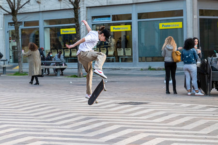 terni, italy march 02 2021: performance with the skateboard in a square with jumpsのeditorial素材