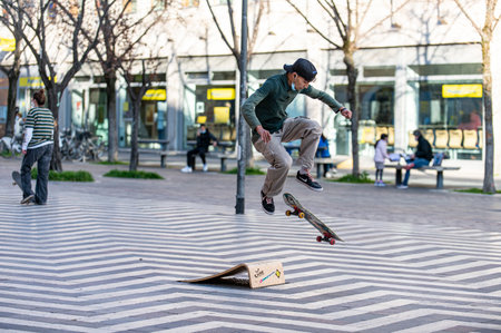 terni, italy march 16 2021: boys doing skateboard stunts in the cityのeditorial素材