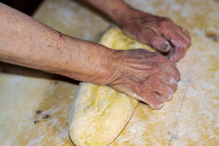 detail roll out the dough with a rolling pin and then make tagliatelleの写真素材