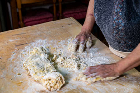 detail roll out the dough with a rolling pin and then make tagliatelleの写真素材