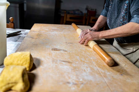 detail roll out the dough with a rolling pin and then make tagliatelleの写真素材