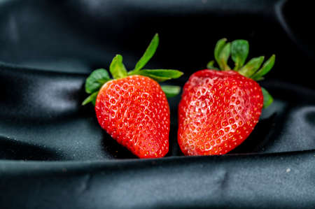 cup of ripe strawberries on wooden backgroundの写真素材