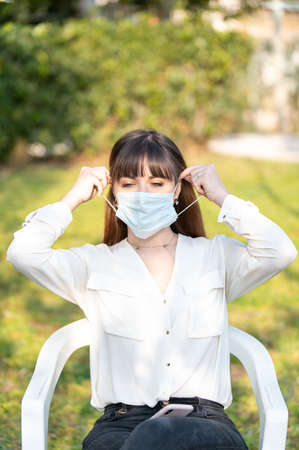 girl wearing medical mask  outdoorsの写真素材