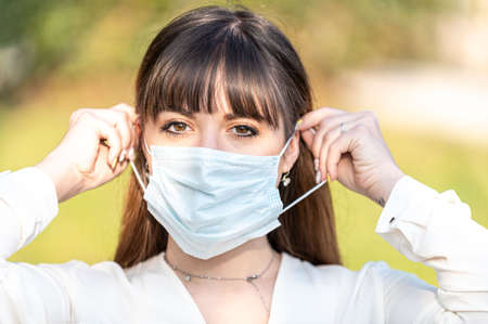 girl wearing medical mask  outdoorsの写真素材