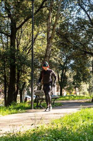 ragzzo does physical activity in the park early in the morningの写真素材