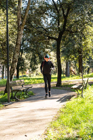 ragzzo does physical activity in the park early in the morningの写真素材