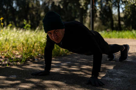 ragzzo does physical activity in the park early in the morningの写真素材