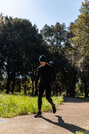 ragzzo does physical activity in the park early in the morningの写真素材