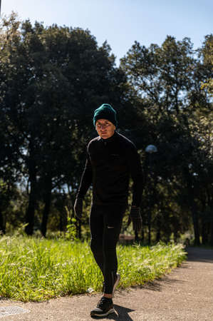 ragzzo does physical activity in the park early in the morningの写真素材