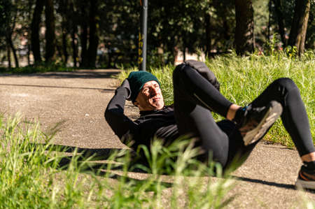 ragzzo does physical activity in the park early in the morningの写真素材