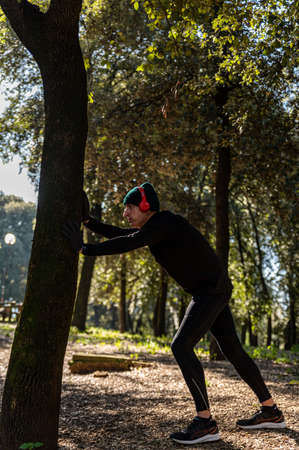 ragzzo does physical activity in the park early in the morningの写真素材